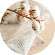 Ginned and cleaned cotton compressed into protective bales